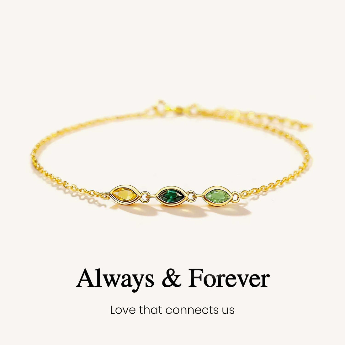 Gold bracelet with green gemstones on a white background, featuring the text 'Always & Forever'.