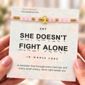 she doesn't fight alone bracelet, pink ribbon breast cancer support message